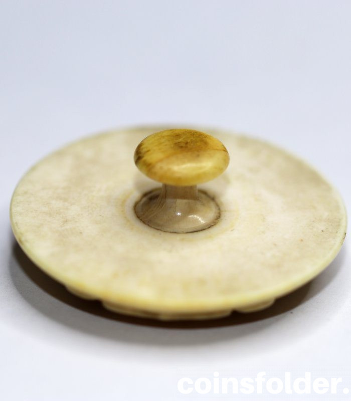 Livery Button made from ivory with the family coat of arms of Von Warnstedt