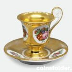 Antique France Paris Porcelain Gilded Flora Lion Handle Cup and Saucer XIX c.