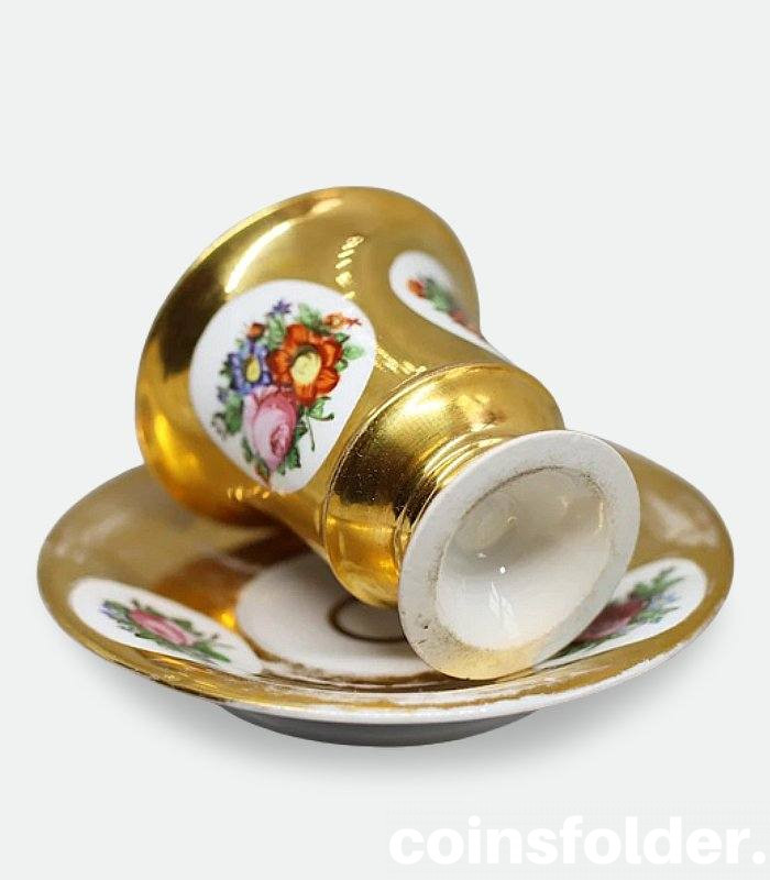 Antique France Paris Porcelain Gilded Flora Lion Handle Cup and Saucer XIX c.
