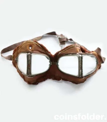 Vintage 1900s motoring and early WWI flying goggles with nickel-plated steel frames, leather face mask, and green silk backing.