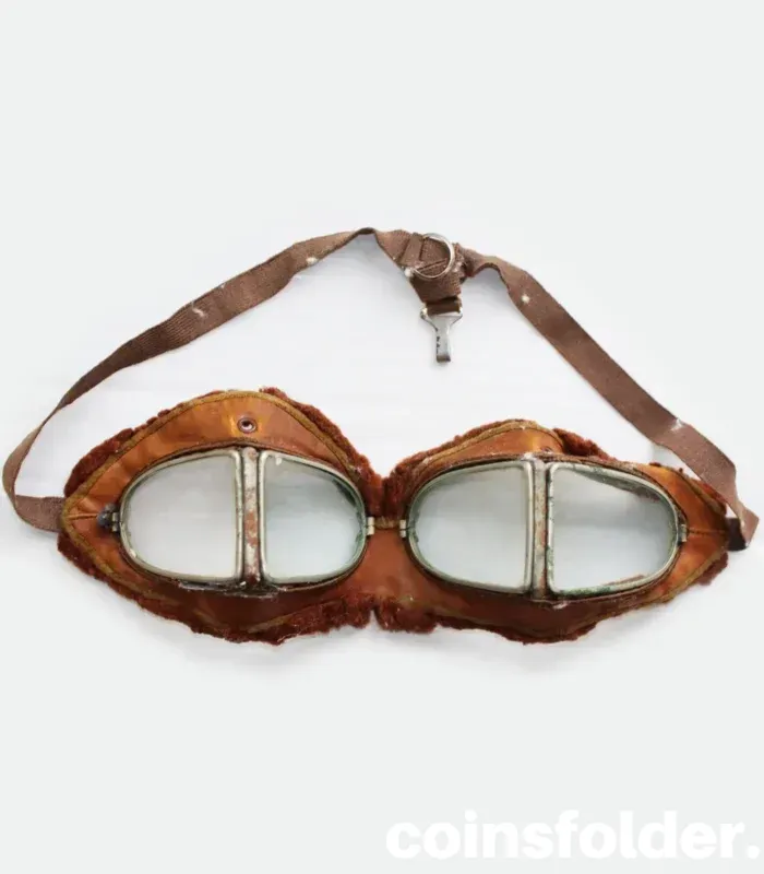 Vintage 1900s motoring and early WWI flying goggles with nickel-plated steel frames, leather face mask, and green silk backing.