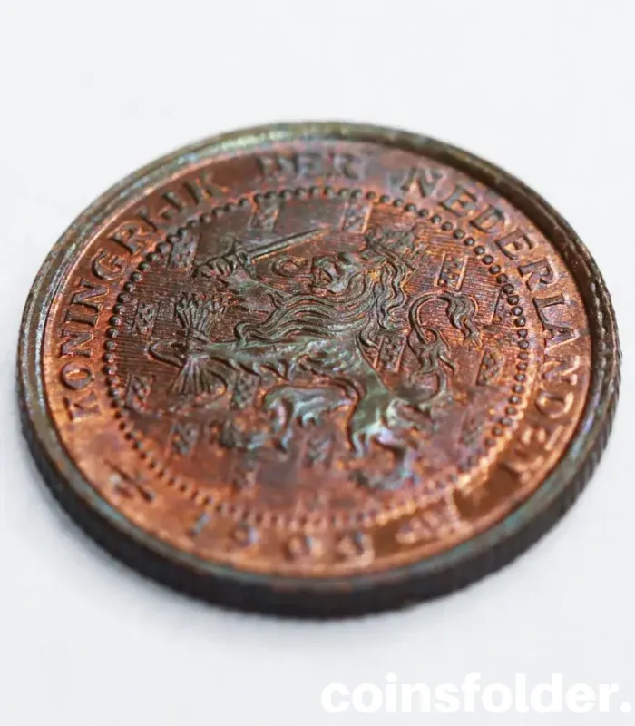 Uncirculated 1903 Netherlands 1/2 Cent coin featuring a crowned lion on the obverse and a value within a wreath on the reverse.