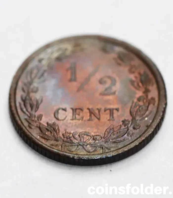 Uncirculated 1903 Netherlands 1/2 Cent coin featuring a crowned lion on the obverse and a value within a wreath on the reverse.