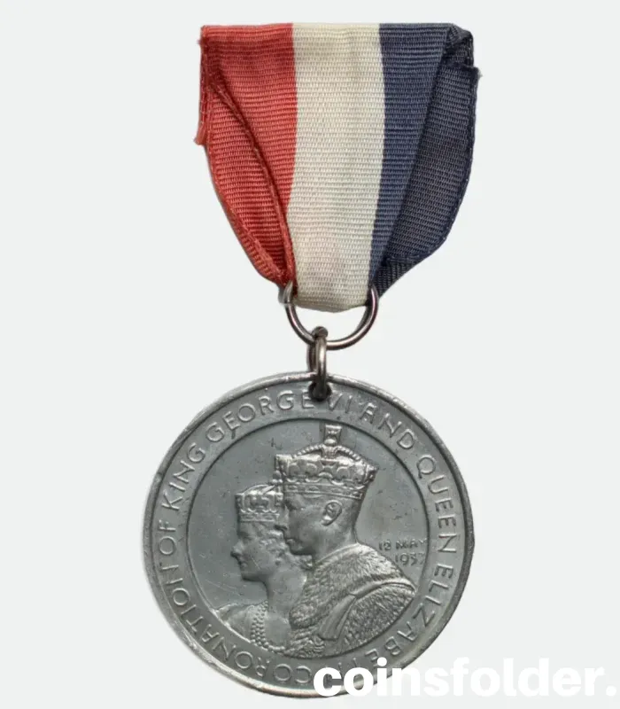 1937 Coronation Medal of King George VI & Queen Elizabeth with blue, white, and red ribbon.