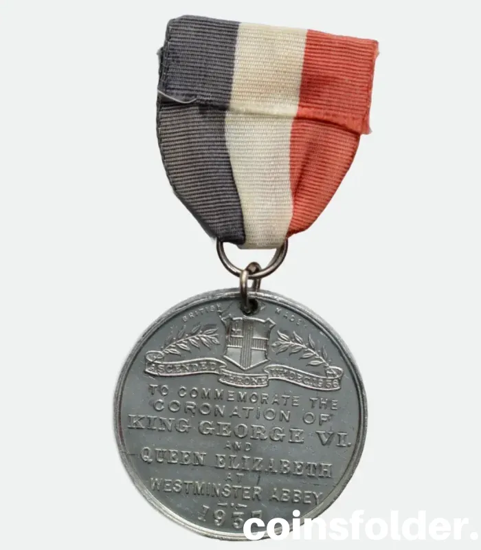 1937 Coronation Medal of King George VI & Queen Elizabeth with blue, white, and red ribbon.