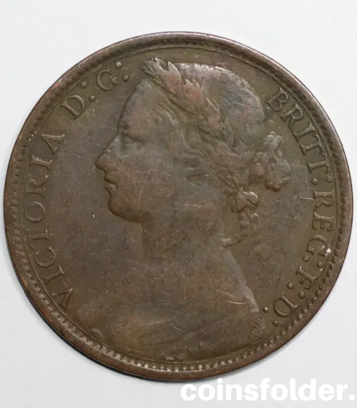 1877 United Kingdom 1 Penny, VG condition with Queen Victoria’s "Bun" portrait.