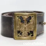 Vintage Spanish Army leather belt with 1943 eagle emblem buckle.