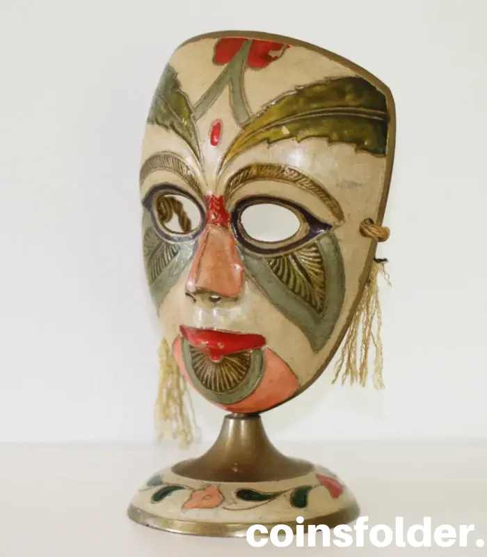 Vintage painted brass carnival mask statuette with colorful design