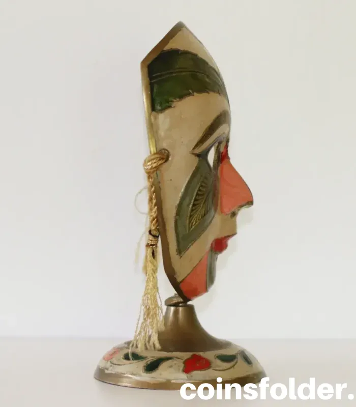 Vintage painted brass carnival mask statuette with colorful design