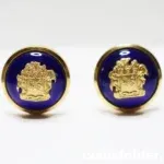 A pair of vintage livery cufflinks adorned with the Family Crest of Von Platen, set against a vibrant blue enamel background.