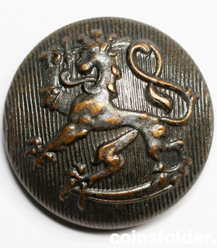 Vintage Finland Army Button by Skoha with intricate military detailing.