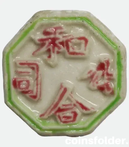 Siam porcelain gambling token with green, red, and blue glaze