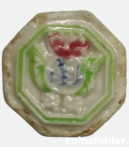 Siam porcelain gambling token with green, red, and blue glaze